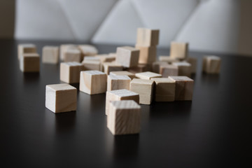 Wooden small blocks on the background. Background for desktop. Office style.Agile and scrum. Team players.Social life.In the office.Equality and diversity