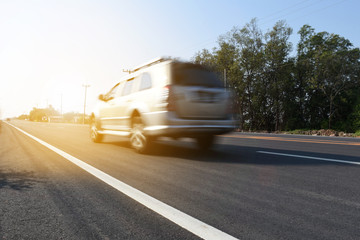 Fototapeta premium Cars are driven on high speed roads. The road stretches forward. There is space and lines of sight.