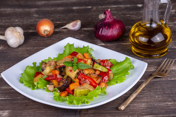 Mixed boiled vegetables on a white plate