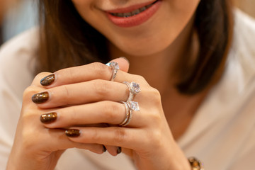 Close up of an elegant diamond rings on woman finger,(soft and sellective focus)