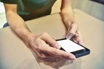 mobile phone on table and one black,People are using a mobile phone to buy a product. And contact friends online.People use mobile phones to make purchases online.