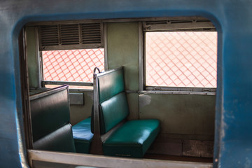 Seat inside old diesel train bogie in Thailand