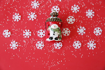 Christmas card with snowflakes and snowman on the red background. Christmas and New Year concept....