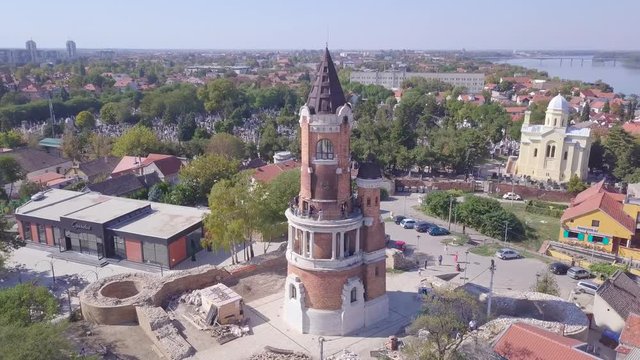 Slow beautiful orbiting aerial shot of Gardos Tower in Zemun Old city, summer day 4k