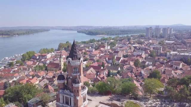 Fantastic opening aerial shot of Gardos Tower in Zemun and old city on hill, summer day