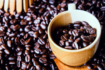 Cup of coffee with coffee beans