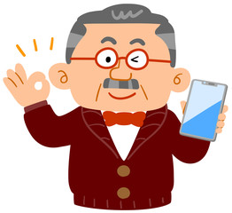 スマートフォンを持ってOKのハンドサインを示すシニアの男性