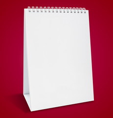 Blank calendar on red background for make date schedule appointment and organizing.