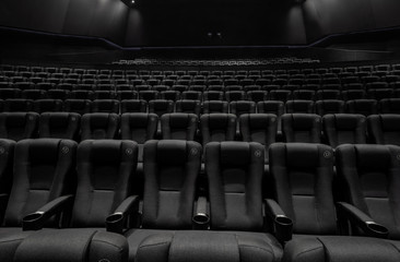 Naklejka premium Black cinema white wide screen and auditorium seats