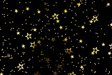 Fototapeta premium Falling star shape confetti on black background. Flat lay, top view. Copy space for your text.
