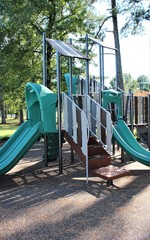 children's playground in the park with green slides