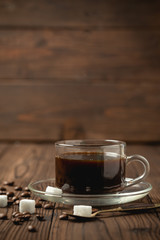 black coffee cup on wooden table.