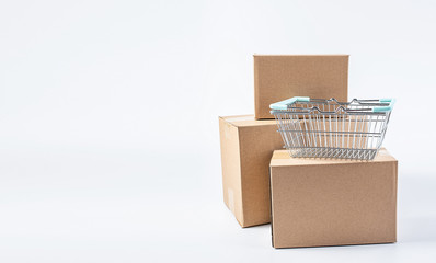 A bunch of express box paper boxes and shopping baskets consumption online shopping concept map