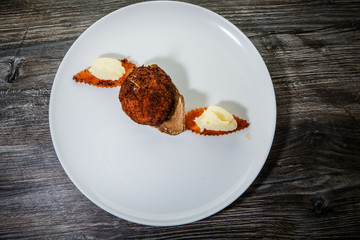 top view on finely decorated chicken kiev cutlet with mashed potato