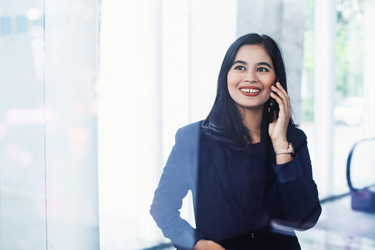 Professional Indonesian Businesswoman Talking On Phone