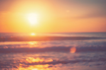 Copy space of soft sand sea and blur tropical beach with sunset sky and cloud abstract background.