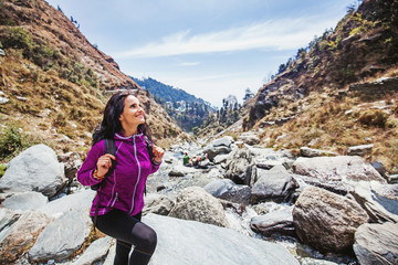 Naklejka na ściany i meble Beautiful woman in her 40s trekking alone in Indian Himalayas