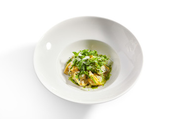 Tortellini with rabbit meat pesto sauce and arugula