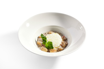 Gnocchi in mushroom sauce with cheese espuma