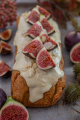 Fototapeta premium home made almond pumpkin pie with with chocolate frosting and figs