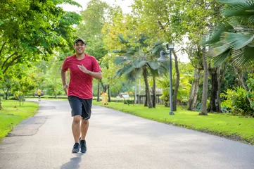 Küchenrückwand glas motiv Healthy runner jogging outdoor. Fitness and sport healthy lifestyle concept. © Nopphon