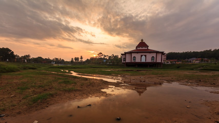beautiful sunrise and reflection over unique architecture mosque in malacca