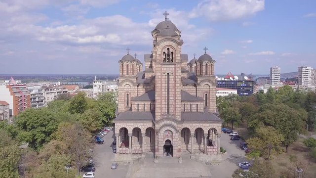Beautiful opening 4k aerial shot of St Mark Church and Belgrade panorama in background
