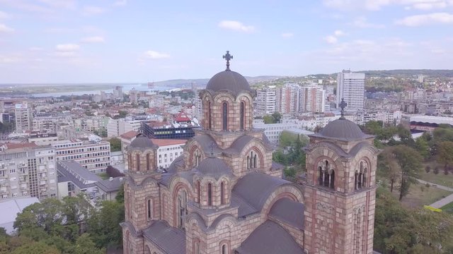 Incredible revealing 4k panorama aerial shot of St Mark Church and Tasmajdan park