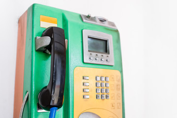 Close-up shot of coin-operated public payphone