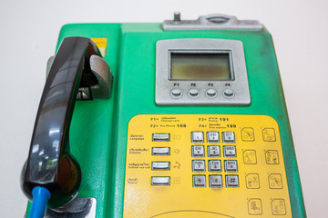 Close-up shot of coin-operated public payphone