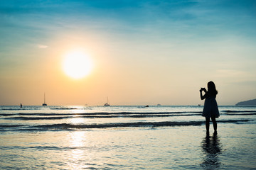 silhouette girl with sunset beach