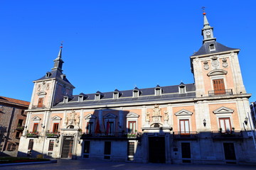Fototapeta na wymiar The Old Town Hall (Casa de la Villa) and the House of Cisneros (Casa de Cisneros) at Plaza de La Villa in Madrid, Spain