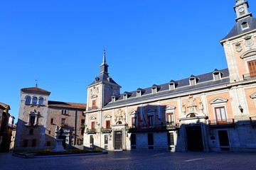 Fototapeta na wymiar The Old Town Hall (Casa de la Villa) and the House of Cisneros (Casa de Cisneros) at Plaza de La Villa in Madrid, Spain