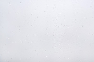 Water drops on white surface background.