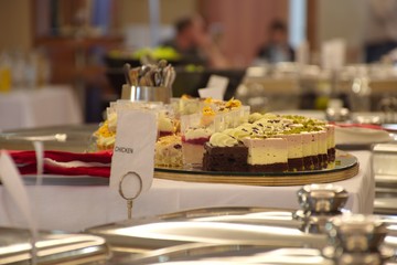 Buffet in restaurant with cookies and food - catering on the table