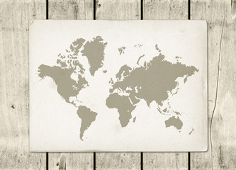 Vintage world map parchment on a wooden wall