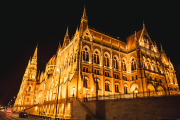 Obraz premium Budapest/Hungary - June 29, 2019 : Hungarian Parliament in Budapest by night, Hungary.