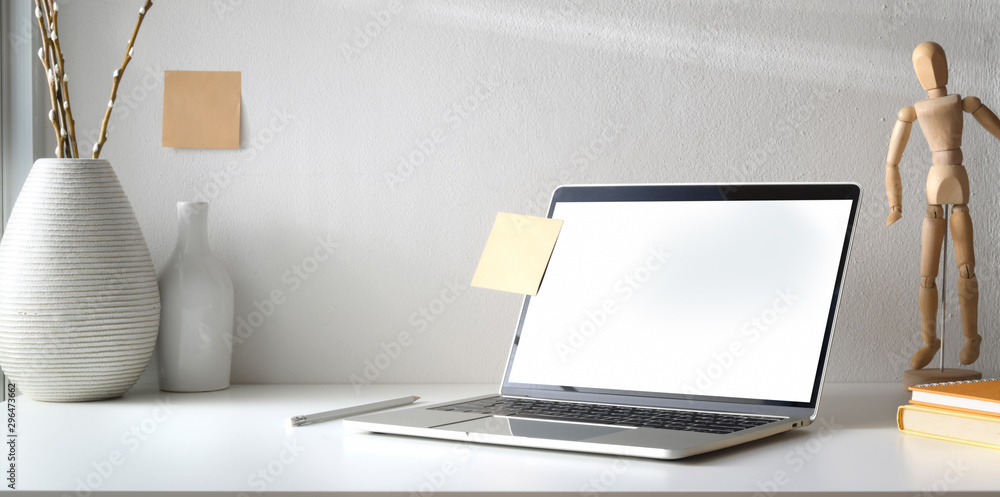 Poster minimal workspace with open blank screen laptop computer and coffee cup