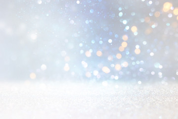 abstract glitter silver, gold , blue lights background. de-focused