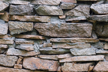 Natural facade stone decoration quartzite background texture. modern granite stone wall