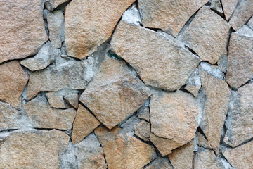 Natural facade stone decoration quartzite background texture. modern granite stone wall
