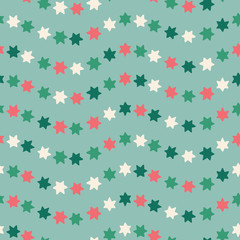 Christmas star seamless pattern background in green, red and white. Hand drawn seasonal vector repeat design.