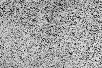 Rough dark relief stucco wall texture background. blank for designers