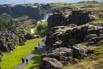Picture of tourist walking go to oxararfoss waterfall at thingvellir national park, in Iceland, Travel Destinations Concept