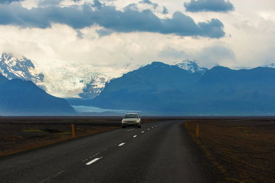 Picture of tourist driving car on the road with look at view glacier skaftafell, vatnajokull national park at summer in Iceland, road trip in iceland