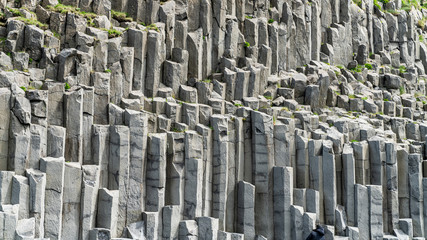Basalt columns geological formation at Reynisfjara beach, Iceland.