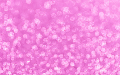 Pink abstract shiny background with bokeh and sparkles. Selective focus, bokeh. Christmas background