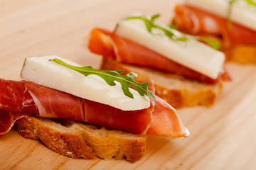 perfect sandwich made with rye bread cheese and Parma ham