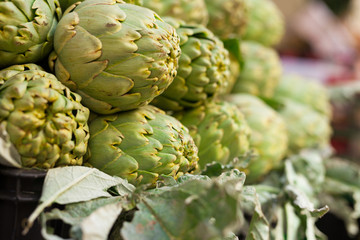 Fototapeta premium Fresh artichokes on market counter