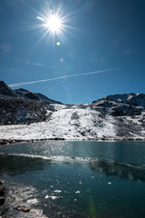 half frozen lake on Lais da Macun